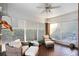 Cozy sunroom with ample natural light, brick flooring, and comfortable wicker furniture at 833 E Morningside Ne Dr, Atlanta, GA 30324