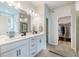 Bathroom features double sink vanity and open walk-in closet at 138 Henley St, Canton, GA 30114