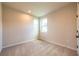 A bright bedroom with neutral paint, carpet, and two windows at 138 Henley St, Canton, GA 30114