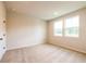 Bedroom with plush carpeting, neutral paint, and dual windows at 138 Henley St, Canton, GA 30114
