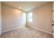 Empty bedroom with neutral carpet and natural light from two windows at 138 Henley St, Canton, GA 30114