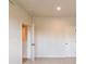 A bright bedroom features neutral paint, carpet, and white doors at 138 Henley St, Canton, GA 30114