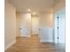 Hallway features wood floor, neutral walls, and white doors at 138 Henley St, Canton, GA 30114