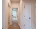 Hallway features wood floor, neutral walls, and white doors at 138 Henley St, Canton, GA 30114