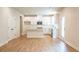 Bright, open kitchen with white cabinetry, island, and stainless steel appliances at 138 Henley St, Canton, GA 30114