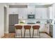 Kitchen with white cabinets, quartz countertops, and stainless steel appliances at 138 Henley St, Canton, GA 30114