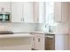 Stylish kitchen featuring quartz countertops, stainless appliances and white cabinetry at 138 Henley St, Canton, GA 30114