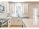 Beautiful kitchen with stainless appliances, stone counter, breakfast bar and outdoor view at 138 Henley St, Canton, GA 30114