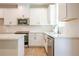 Clean kitchen featuring stainless steel appliances, stone countertops, and custom backsplash at 138 Henley St, Canton, GA 30114