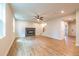 Spacious living room with fireplace, ceiling fan and hardwood floors at 138 Henley St, Canton, GA 30114
