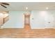 Open floor plan with hardwood floors, staircase and view to entry door at 138 Henley St, Canton, GA 30114