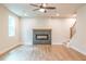 Spacious living room with fireplace, ceiling fan and hardwood floors at 138 Henley St, Canton, GA 30114