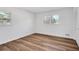 Bright bedroom with hardwood floors and two windows at 2876 Wendwood Dr, Marietta, GA 30062