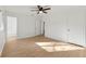 Spacious bedroom featuring wood floors, natural light, and an open doorway at 708 Martin Rd, Stone Mountain, GA 30088