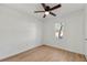 Bright bedroom with wood floors, ceiling fan, and a window view of the outdoors at 708 Martin Rd, Stone Mountain, GA 30088