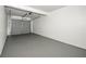Clean, spacious garage with gray concrete flooring and an automatic door opener at 708 Martin Rd, Stone Mountain, GA 30088