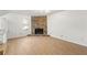 Spacious living room featuring a stone fireplace and light wood flooring at 708 Martin Rd, Stone Mountain, GA 30088