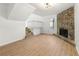 Bright living room with hardwood flooring and a stone fireplace at 708 Martin Rd, Stone Mountain, GA 30088