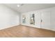 Bright, open room featuring hardwood flooring and lots of natural light at 708 Martin Rd, Stone Mountain, GA 30088