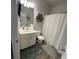 Cozy bathroom with a shower curtain, neutral colors, and clean design at 5257 Shorthorn Way, Powder Springs, GA 30127