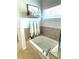 Cozy bathtub surrounded by ceramic tiles, complemented by decorative wall accents and a bright window at 5257 Shorthorn Way, Powder Springs, GA 30127