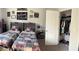Charming bedroom with two beds, decorative wall art, and an organized closet at 5257 Shorthorn Way, Powder Springs, GA 30127