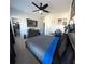 Bedroom featuring modern decor, walk-in closet, and a mounted television at 5257 Shorthorn Way, Powder Springs, GA 30127