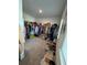 Spacious walk-in closet with ample hanging space, shelving, and shoe storage at 5257 Shorthorn Way, Powder Springs, GA 30127