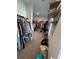 Large walk-in closet with clothes racks, shelving and storage, offering plenty of room at 5257 Shorthorn Way, Powder Springs, GA 30127