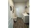Practical laundry room with washer, dryer, and storage at 5257 Shorthorn Way, Powder Springs, GA 30127