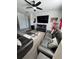 Comfortable living room features seating, a TV, and ample natural light at 5257 Shorthorn Way, Powder Springs, GA 30127