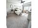 Elegant main bedroom with a tray ceiling, stylish furniture, and ample natural light at 5257 Shorthorn Way, Powder Springs, GA 30127