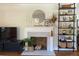 White fireplace mantel with decorative elements at 91 Morris Brown Sw Dr, Atlanta, GA 30314