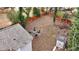 Aerial view of the backyard with a fire pit, a storage shed, and a wooden fence at 91 Morris Brown Sw Dr, Atlanta, GA 30314