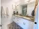 Elegant bathroom featuring double vanities, granite countertops, and modern fixtures at 91 Morris Brown Sw Dr, Atlanta, GA 30314