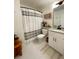 Bathroom with a shower-tub combo, large tiles, and a vanity with white cabinets at 91 Morris Brown Sw Dr, Atlanta, GA 30314