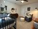 Comfortable Bedroom with crib, dresser, round mirror, and cozy gray chair, perfect for a peaceful retreat at 91 Morris Brown Sw Dr, Atlanta, GA 30314