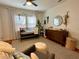 Charming Bedroom featuring a crib, dresser with changing station, and a cozy armchair on a large rug at 91 Morris Brown Sw Dr, Atlanta, GA 30314