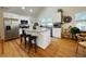 Bright kitchen with an island, granite countertops, modern appliances, and hardwood floors at 91 Morris Brown Sw Dr, Atlanta, GA 30314