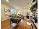 Inviting living room with hardwood floors, large windows, and a cozy sofa, perfect for relaxation and gatherings at 91 Morris Brown Sw Dr, Atlanta, GA 30314