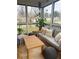 Relaxing screened porch with a comfortable daybed, decorative pillows, and outdoor seating, offering a serene retreat at 91 Morris Brown Sw Dr, Atlanta, GA 30314