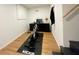 Functional basement workout area with a stationary bike and dedicated space for exercise equipment at 91 Morris Brown Sw Dr, Atlanta, GA 30314