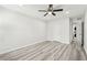 Bedroom with modern ceiling fan and doorway to a laundry area at 5400 Roswell Rd # C3, Atlanta, GA 30342