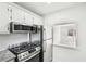 Updated kitchen with stainless steel appliances and a view to a bright, airy room at 5400 Roswell Rd # C3, Atlanta, GA 30342