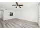 Bright living room with a ceiling fan, modern flooring, and a view into the kitchen, perfect for entertaining at 5400 Roswell Rd # C3, Atlanta, GA 30342