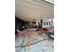 Relaxing covered back porch with outdoor seating and charming decor at 359 Cornish Mtn Rd, Oxford, GA 30054