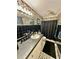 Bathroom featuring black and white tile, with black shower curtain and light fixtures at 359 Cornish Mtn Rd, Oxford, GA 30054