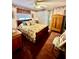 Cozy bedroom with floral bedding, a wooden wardrobe, and soft natural light at 359 Cornish Mtn Rd, Oxford, GA 30054