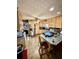 Functional kitchen boasts wood cabinetry, stainless steel appliances, and a breakfast bar at 359 Cornish Mtn Rd, Oxford, GA 30054