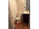 A powder room featuring a modern vanity and sink, toilet, and neutral decor at 2705 Greystone Pl, Austell, GA 30106